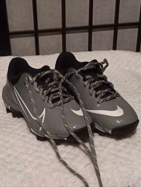 Nike Gray Soccer Cleats with White Swoosh and Neon Accents